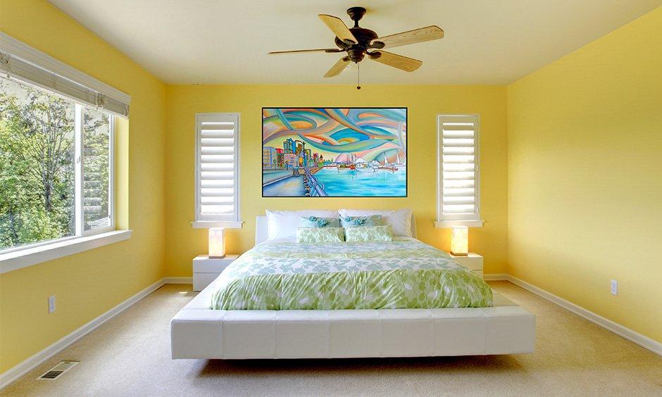 Yellow bedroom with warm lighting, soft textures, and well-balanced colours