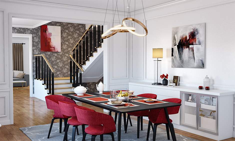 Sleek, minimal dining room with ample natural light, decluttered surfaces, and seasonal decor accents.