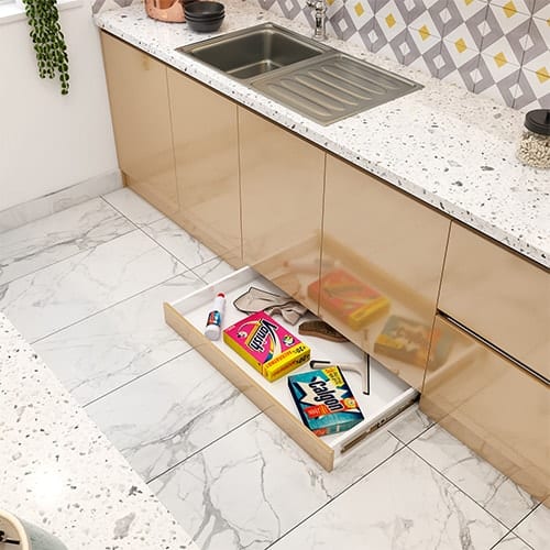 Home interior designer in Vadodara created a skirting drawer that utilizes the dead space