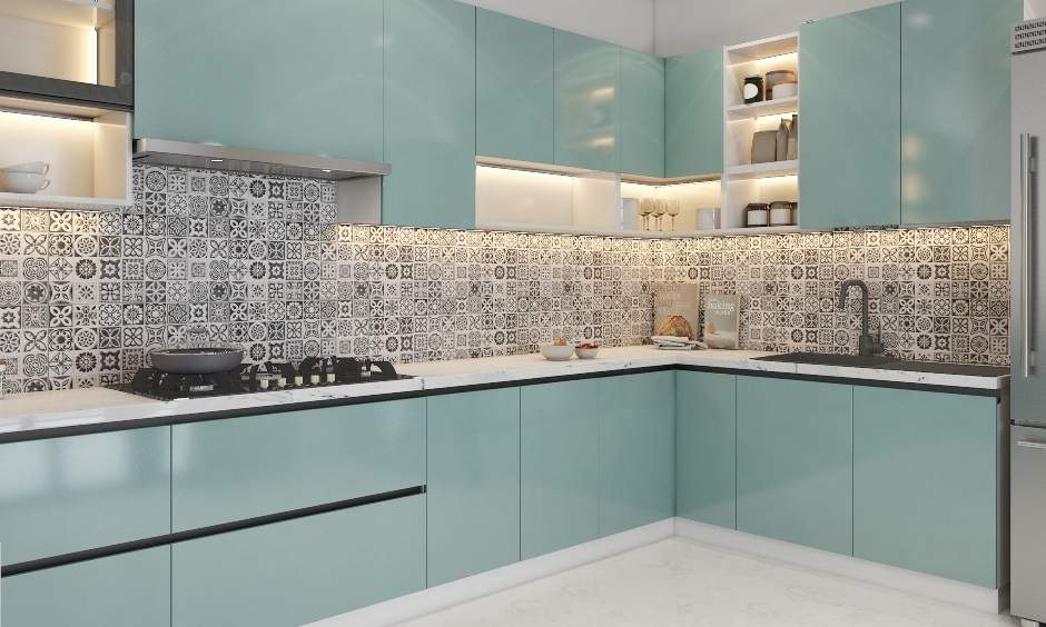 Well-lit pastel blue kitchen with handless cabinets and sink
